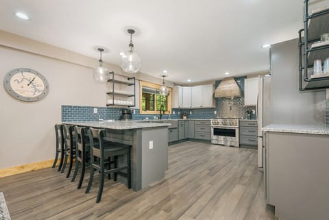 The kitchen is fully equipped and has seats for four at the breakfast bar.