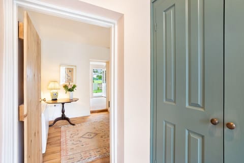 Enter Moat Cottage through the charming hallway, setting the tone for a cosy, welcoming stay in the heart of North Yorkshire.