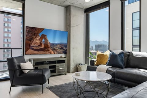 Highly Designed living room. Spacious Comfy Leather Couch. 75` TV. Amazing view of mountains and City.