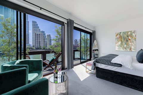 A Modern Bedroom with a picturesque view of the river