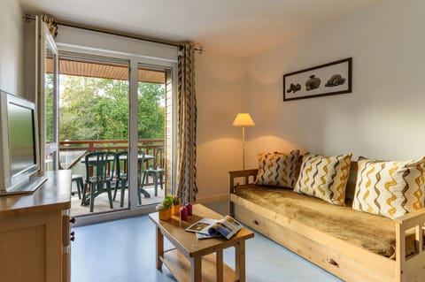 Find peace and relaxation with your close friends and family in this stunning open-concept living room featuring natural decor.