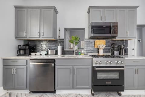 The fully equipped kitchen is ready for family meals, featuring modern appliances and plenty of counter space.