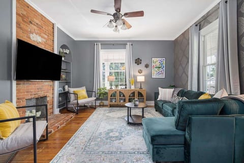 Relax and unwind in the spacious living room, where comfort and style meet for the perfect family hangout.