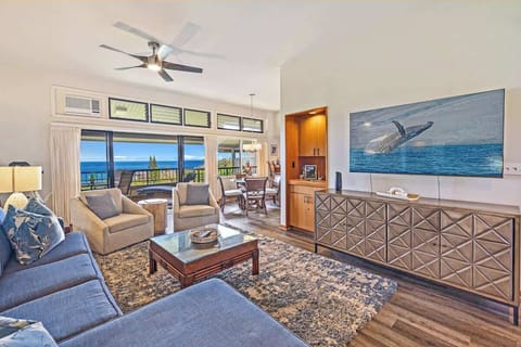 Spacious seating in the family room with large TV for movie nights,