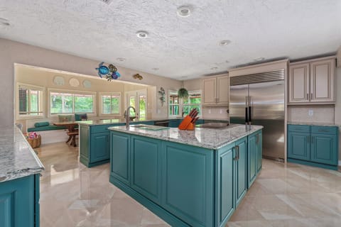 Gather around a welcoming kitchen designed for comfort, connection, and cooking.