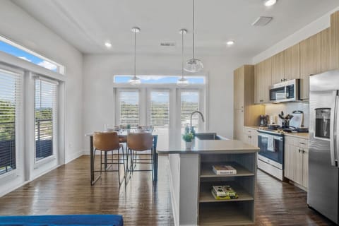 The kitchen invites you to experiment with new recipes, offering a stylish and practical space to cook and create.