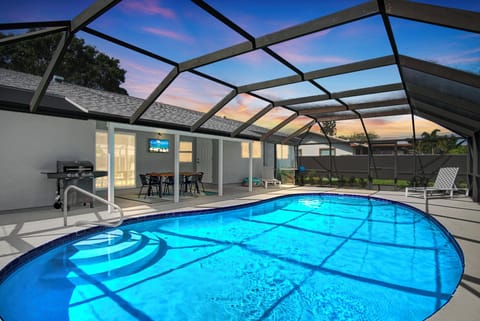 Private pool, outdoor TV, grill & patio dining — relax under the sunset