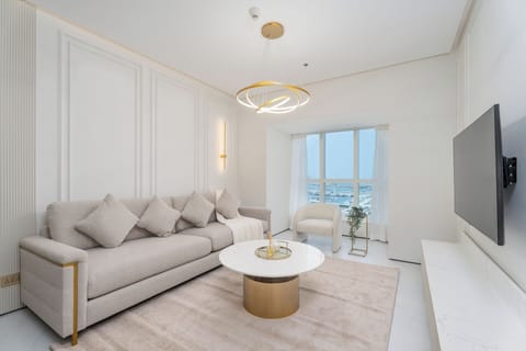 Deluxe Apartment, Balcony, Marina View | Living area | 55-inch Smart TV with cable channels