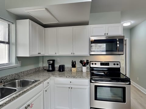 Condo, 1 King Bed with Sofa bed, Patio, Garden View (PC Beach Retreat A - No Pets Allowed) | Private kitchen | Fridge, microwave, oven, stovetop