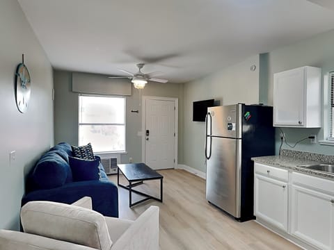 Condo, 1 King Bed with Sofa bed, Patio, Garden View (PC Beach Retreat A - No Pets Allowed) | Living area | 42-inch TV with digital channels