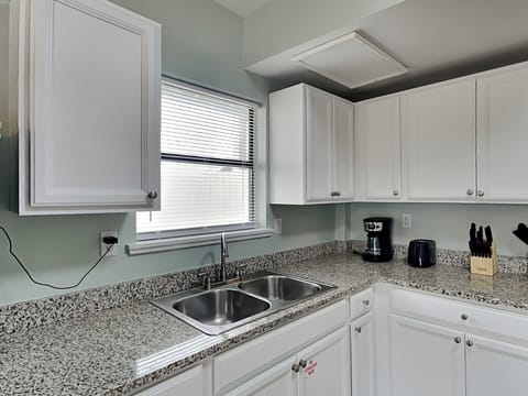 Condo, 1 King Bed with Sofa bed, Patio, Garden View (PC Beach Retreat A - No Pets Allowed) | Private kitchen | Fridge, microwave, oven, stovetop