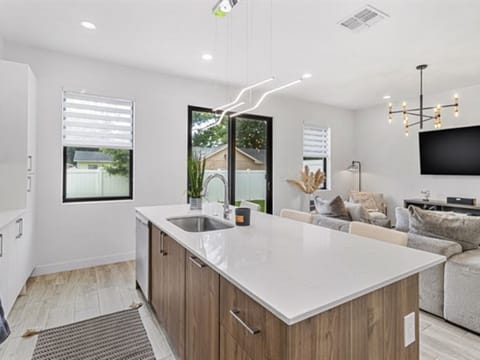 Both units have the same floorplan with a modern kitchen and family room.