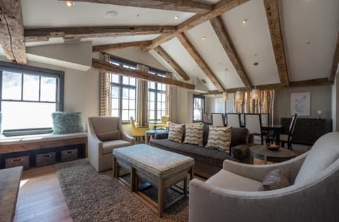 Spacious living room with stunning vaulted ceilings and cozy seating.