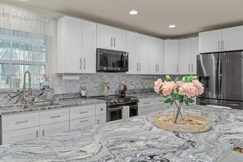 The Kitchen is fully equipped with all new appliances .