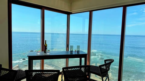 Ocean view from indoor/outdoor patio, queen murphy bed, bedroom. 