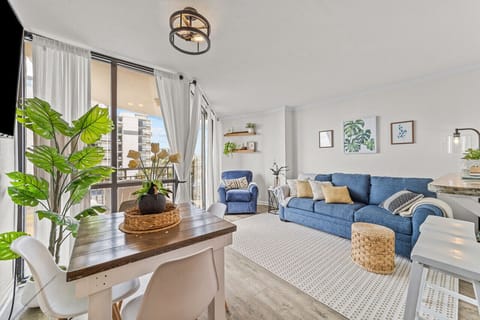 Relax in style! Cozy living room with floor-to-ceiling windows overlooking the beach.
