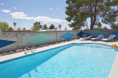 Relax on the outdoor poolside chaise lounges.