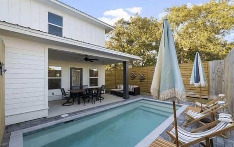 *Please note the layout of the backyard has changed. Refer to the updated pictures for the new layout show casing a hot tub, outdoor bar, outdoor TV, outdoor shower, and a mini-fridge.*