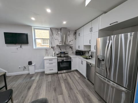Sleek, modern kitchen with everything you need, including filtered water on tap! Whip up a culinary masterpiece with ease.  From stainless steel appliances to ample counter space, cooking here is a joy