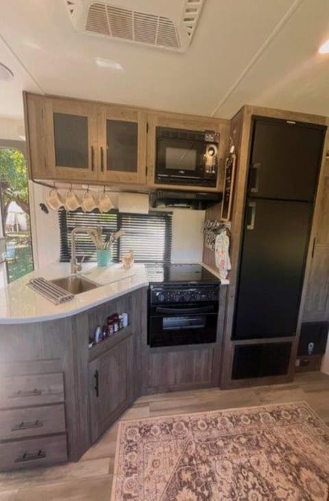 Kitchen - stove, oven, sink, microwave, fridge, separate freezer, and pantry.