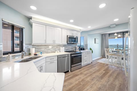 Modern kitchen with high-end appliances and ample counter space.