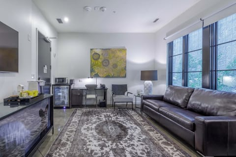 Open-concept suite with sleeper sofa.