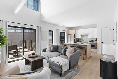 Stunning high ceilings, open floor plan, and lots of natural light in this premium downtown condo. All the most comfortable furnishings and details provided for ease of your stay.