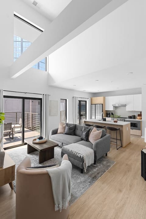 Stunning high ceilings, open floor plan, and lots of natural light in this premium downtown condo. Smart TV in the living room with all the streaming apps and a comfortable sleeper sofa. Glass sliding doors leading to the spacious private patio.