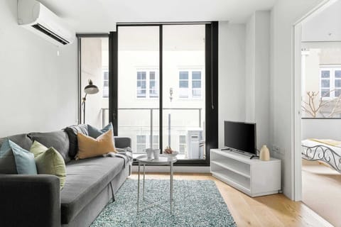 The living area with a 3-seater sofa bed that folds out to a queen.