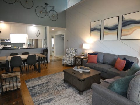 Living area looking into full kitchen.