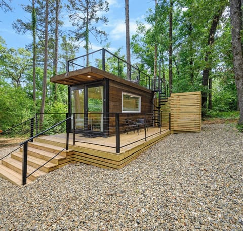 A cozy romantic tiny cabin nestled in the pines of Hochatown near Broken Bow Lake.