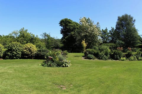 Expansive 2 acre gardens.