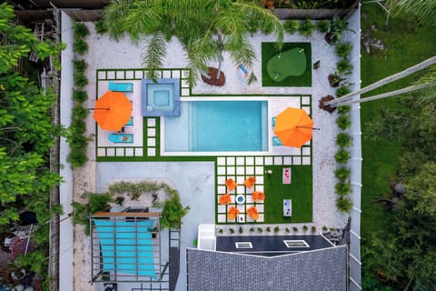 Escape to your private resort! Our spacious backyard features an inground pool, putting green, and cozy fire pit—perfect for family fun and relaxation near the beach. Enjoy unforgettable moments in paradise!
