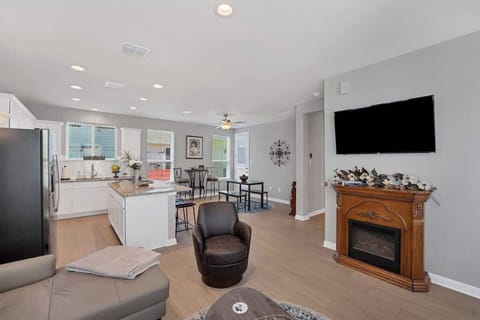 The electric fireplace adds a cozy ambience.