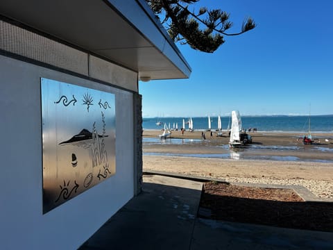 Beach nearby, white sand, sun loungers, beach towels