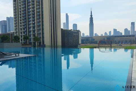 Relax at the poolside with a clear view of the Burj Khalifa and the city skyline.