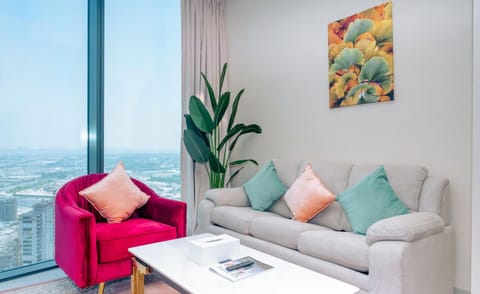 Cozy living room with comfortable seating and plenty of natural light.