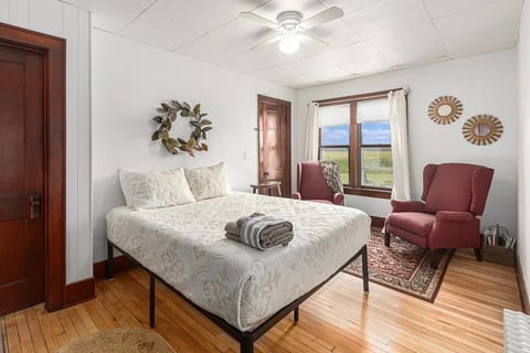 Bedroom 1 - Bedroom 1: Located on main floor with queen size bed and sitting area with two wing back chairs