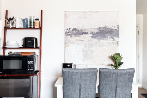 Workspace meets kitchenette. Desk area for all of our remote workers, and a basic kitchenette and coffee station to get you through the day, until you can venture outside!