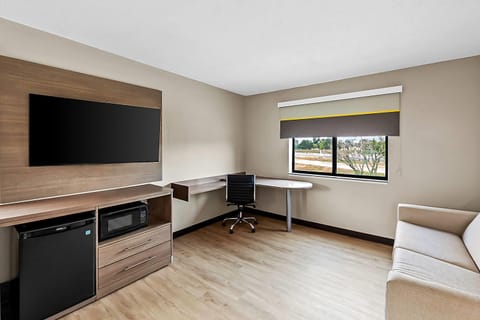 Suite, 1 King Bed, Non Smoking | Desk, laptop workspace, blackout drapes, free WiFi