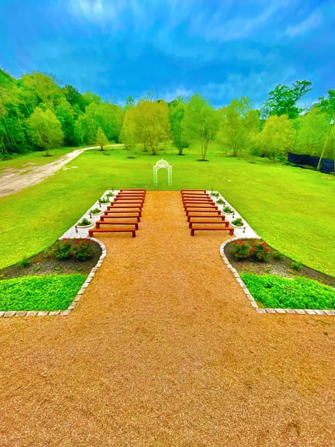 Patio 1, Front ceremony patio w movable benches and arch.