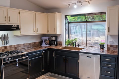 Fully stocked kitchen with cooking and baking essentials! Gas range & spacious