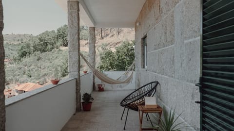 Relax in the outdoor hammock surrounded by nature, the perfect spot to unwind in a peaceful rustic setting. #OutdoorOasis #RusticEscape