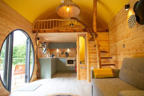 Sofa with views to the deck and woodland