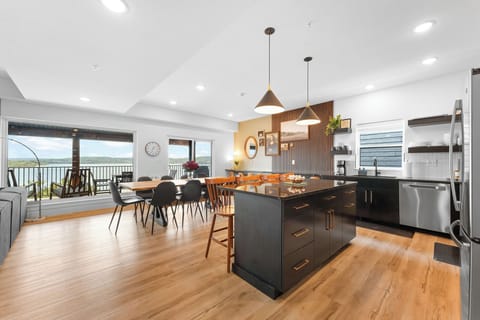 Modern kitchen and dining area with incredible lake views that elevate every meal and gathering.
