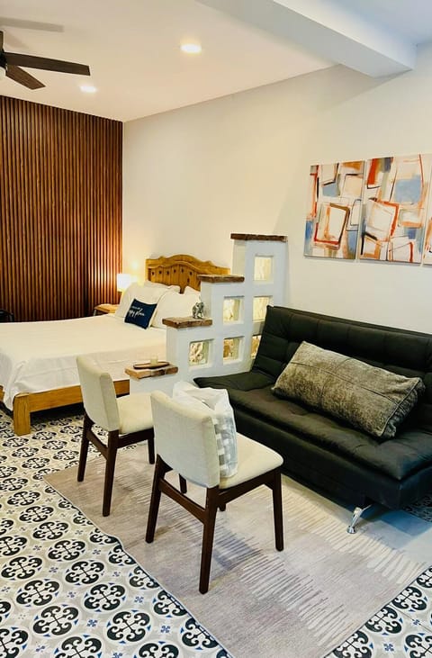 Separate sleeping, living, dining and cooking areas