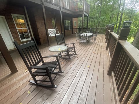 Deck with table/umrella, 6 rocking chairs, and swing to watch the deer roaming