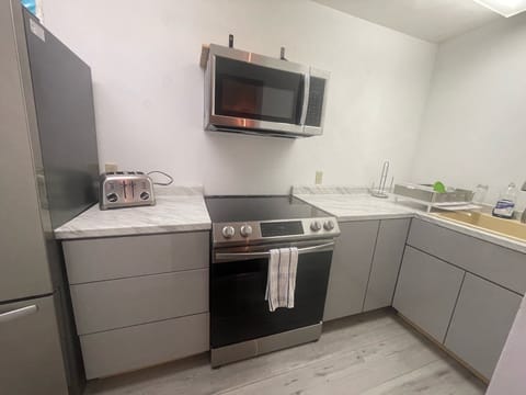 Shared fridge, microwave, coffee/tea maker, highchair