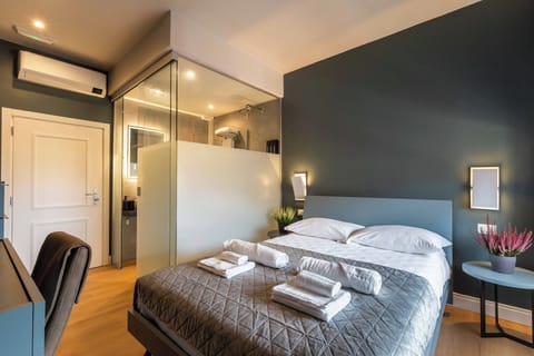 Junior Double Room, City View | In-room safe, desk, laptop workspace, blackout drapes