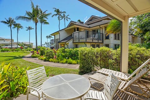 Tropical paradise meets comfort at this charming property, surrounded by swaying palms, lush gardens, and sunny skies, creating a serene Hawaiian retreat experience.